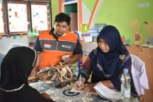 Posko Rumah Zakat disambut baik warga Kampar (foto/istimewa)