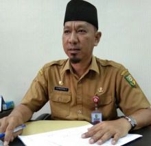 Kepala Disdukcapil Kuansing, Reffendi  Zukman (foto/zar)