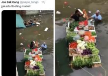 Penjual sayur di atas banjir di DKI Jakarta (foto/int)