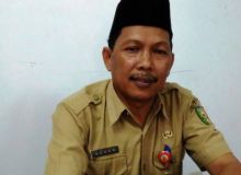 Kepala Dinas Kopdagrin Kuansing, Azhar (foto/int)