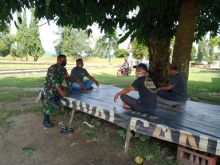 Antisipasi Penyebaran Virus Corona, Babinsa Berikan Komsos di Desa Muara Takus