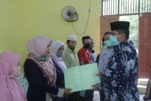 Bupati Siak Serahkan 254 Sertifikat Hak Milik Tanah Program Pendaftaran Tanah Sistematis Lengkap ke Masyarakat Sabak Auh (foto/lin)