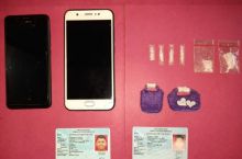 Barang bukti dari dua tersangka