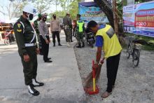 Razia Masker, Tim Satgas Covid-19 Patroli di Ruas Jalan Telaga Biru Tembilahan (foto/Rgo)