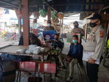 Polsek Kuala Kampar Imbau Warga di Dermaga Teluk Dalam Terapkan Prokes