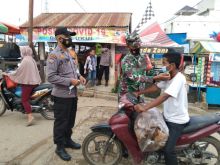 Polsek Ukui Dirikan Posko PPKM di Pintu Masuk Pasar Tradiasional Ukui