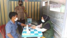 Polsek Kerumutan Bersama Puskesmas Kecamatan Kerumutan Gencar Sosialisasi Prokes