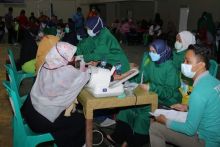 Vaksinasi Massal Dalam Rangka HUT Bhayangkara Digelar di Tualang, Ini Kata Wabup Husni Merza (foto/lin) 