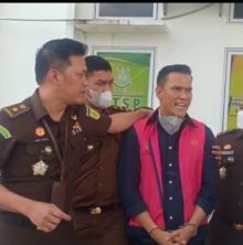 IAL saat digiring petugas kejaksaan/Ist