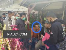 Tersangka HBU saat diamankan petugas kejaksaan negeri dan Satreskrim Polres Bengkalis