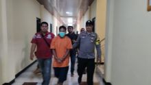 Tersangka saat ditahan Polisi
