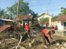 Satgas TMMD ke 118 saat Goro bersama membersihkan TPU
