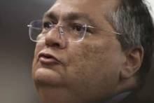 Menteri Kehakiman dan Keamanan Publik Brasil Flavio Dino memberi isyarat selama konferensi pers di Istana Kehakiman di Brasilia pada 9 Januari 2023 /AFP