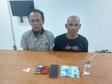 Dua tersangka dan barang bukti