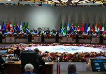 Presiden Afrika Selatan Cyril Ramaphosa memberikan pidato pembukaan/ AFP