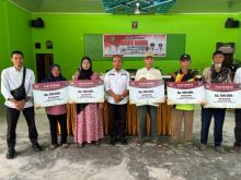 Pemerintah Desa Simpang Ayam salurkan Bantuan Langsung Tunai (BLT) Dana Desa dilaksanakan di Gedung kantor Desa Simpang Ayam, Kecamatan Bengkalis, Rabu 26 November 2025.